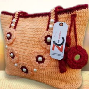 women peach crochet floral handbag